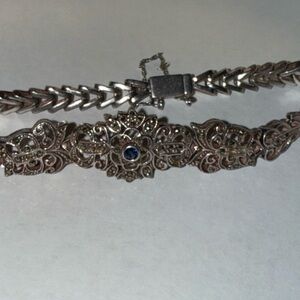 Ornate Silver-Tone Filigree Bracelet with Blue Accent